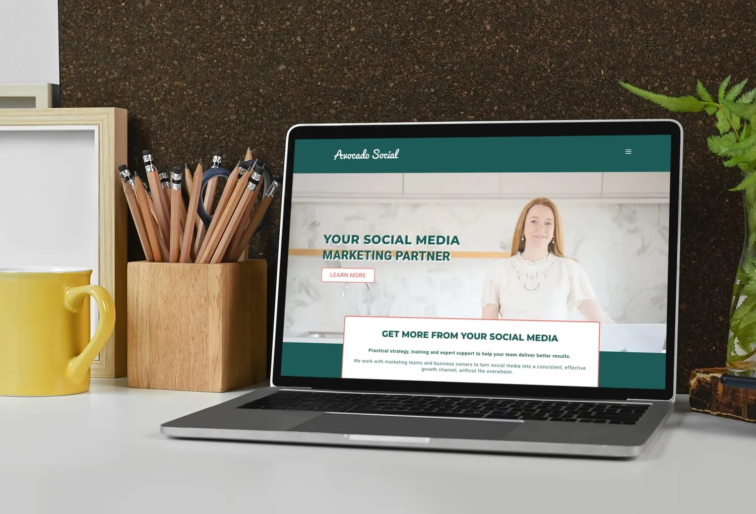 Avocado Social website designed and built by Codebreak, shown on a laptop
